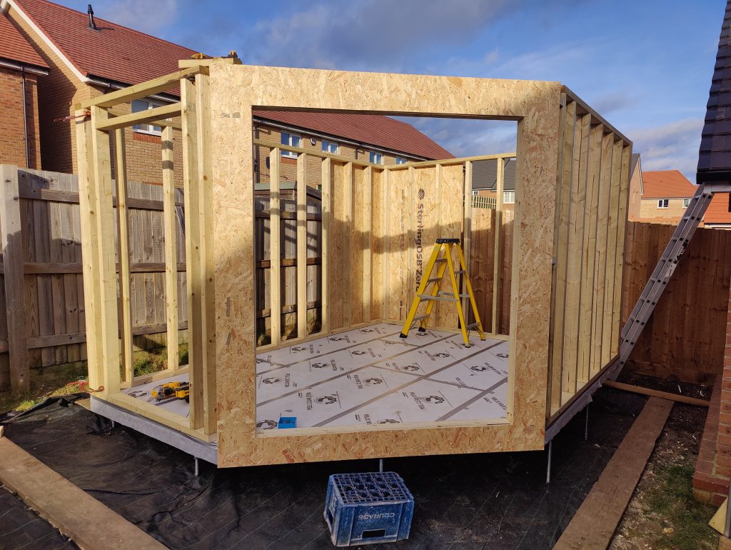 The Mallard Garden Room In St Albans - Exterior (Wooden Framework Under Construction With A Ladder Inside, Ready For Further Building)